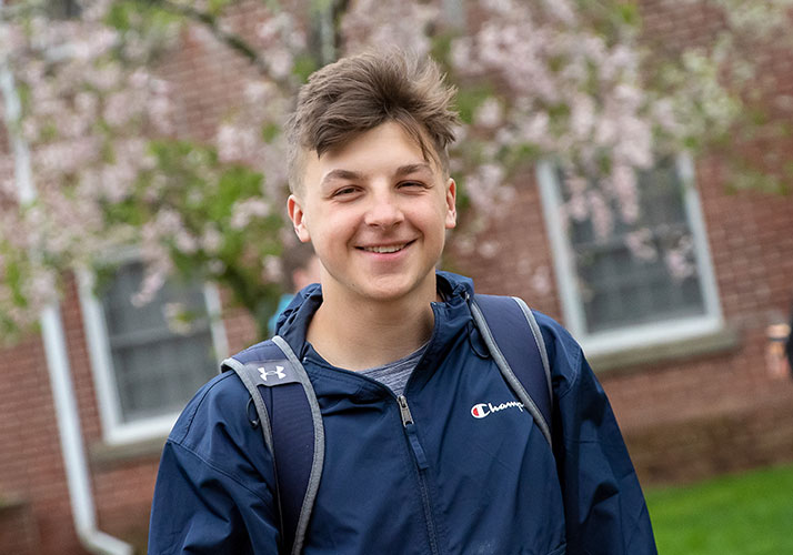 Photo of a happy student. Links to Gifts by Estate Note